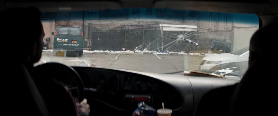 Ivan and Tomas look at the arrow that just punched through their windshield.