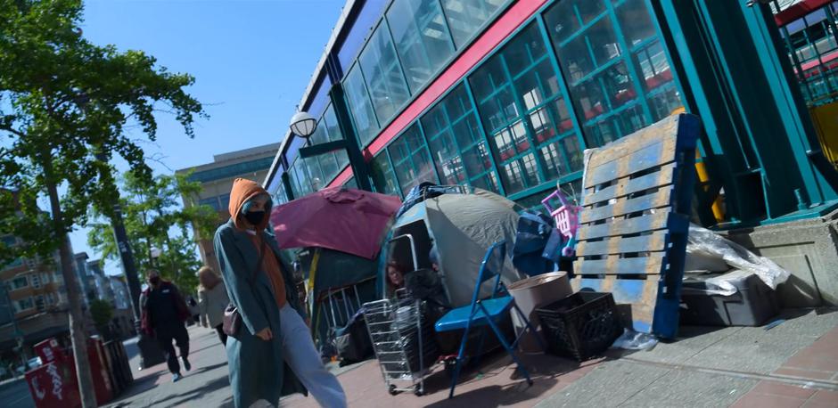 Angela passes a small homeless encampment as she heads towards the station.