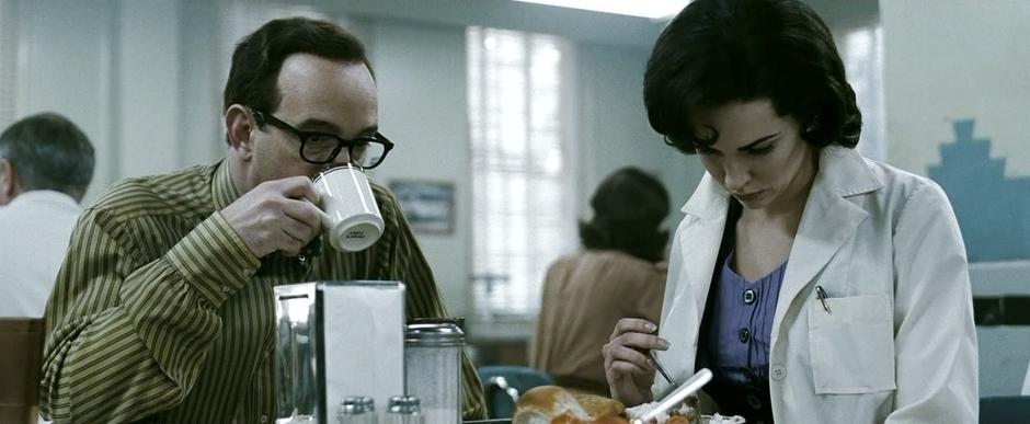 A young Sally Jupiter eats in the base cafeteria.