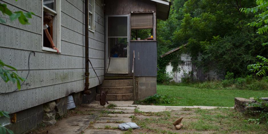 Nancy throws her bag and shoes out the window when she sneaks out in the morning.