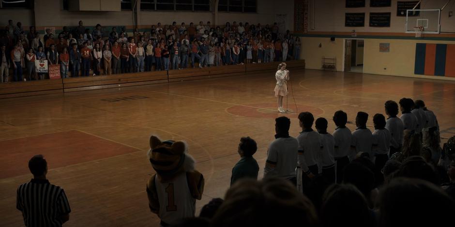 Tammy Thompson sings the national anthem in front of the crowd.