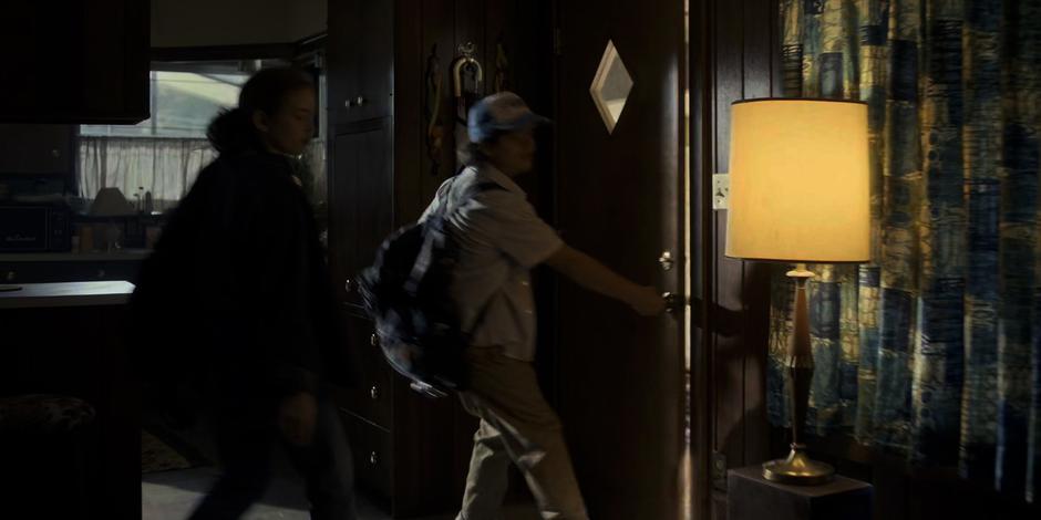 Max and Dustin head out the front door to investigate.