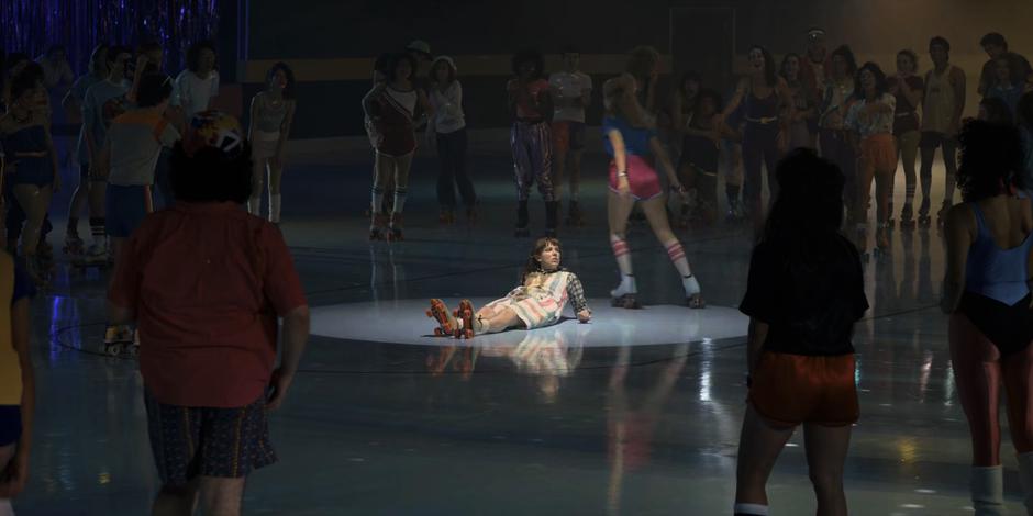 Angela skates around El on the ground after taunting her.