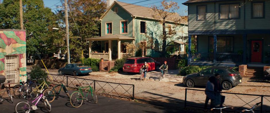 Bruno and Kamala bike away from the house on their way to Avengercon.