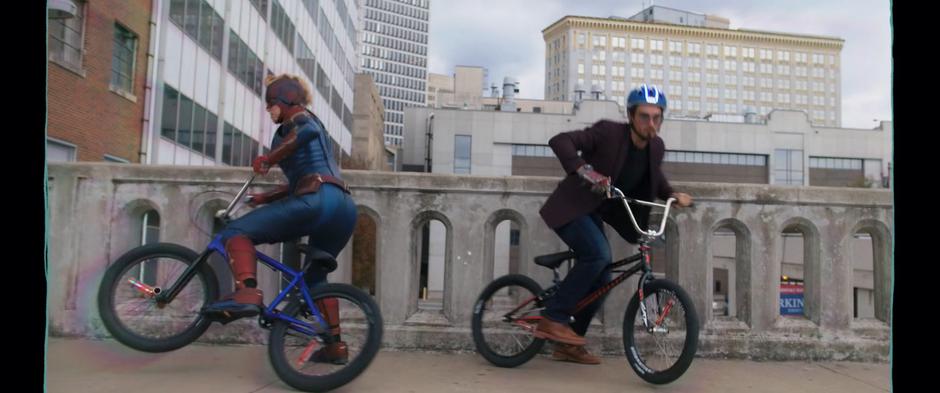 Kamala and Bruno turn their bikes around in Kamala's fantasy to catch the bus.