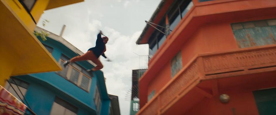 Najma leaps from an adjacent building to the balcony Waleed landed upon.