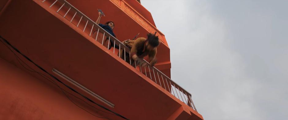 Waleed falls over the railing after being stabbed in the back by Najma.