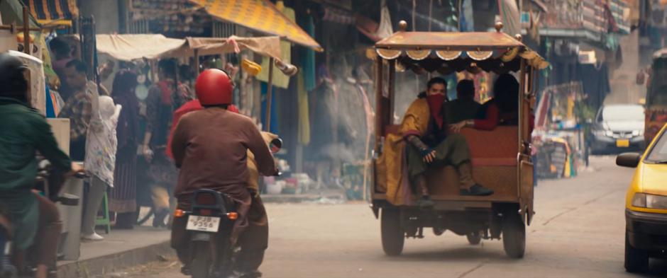 Waleed, Kareem, and Kamala speed off down the street on a stolen vehicle.