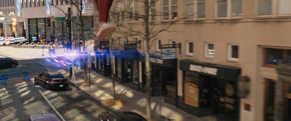 Kamala leaps from platform to platform over the street.