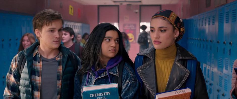 Bruno, Kamala, and Nakia talk as they walk down the hallway.