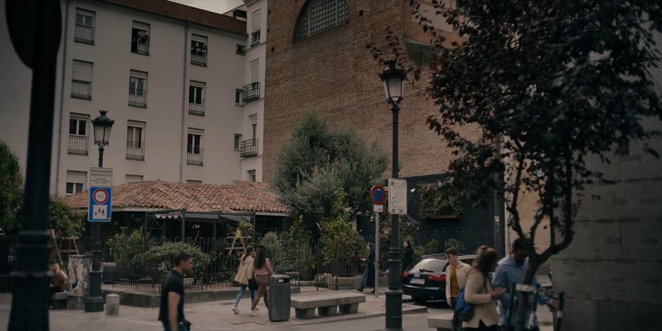 Camila and Mother Superion walk down the street to where the signal led them.