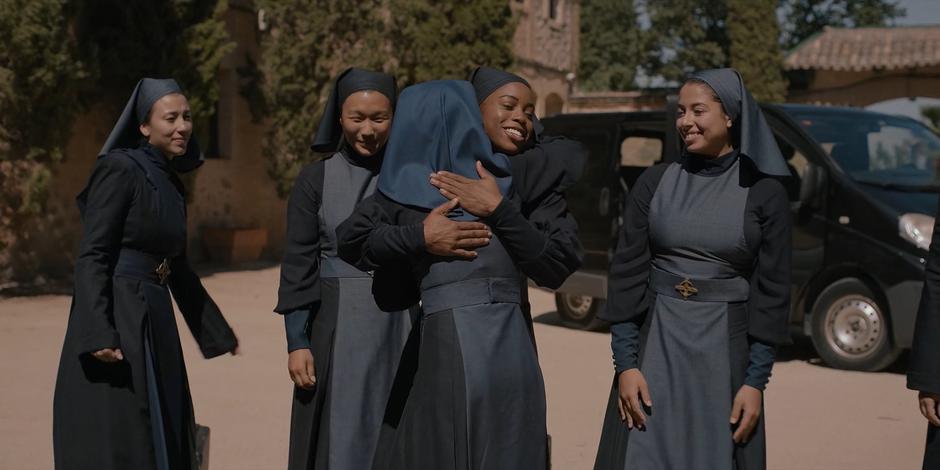 Camila hugs and greets the newly arrived nuns.