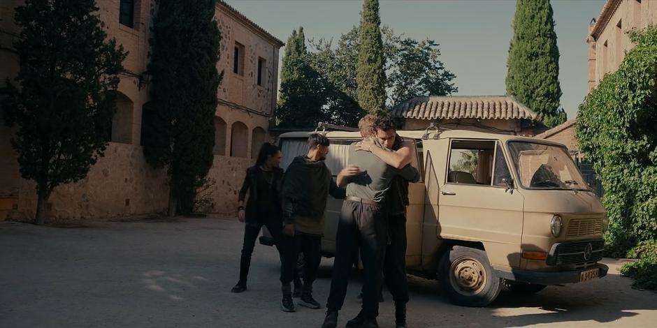 Michael hugs the newly arrive Samaritan Todd as the others unpack their van.