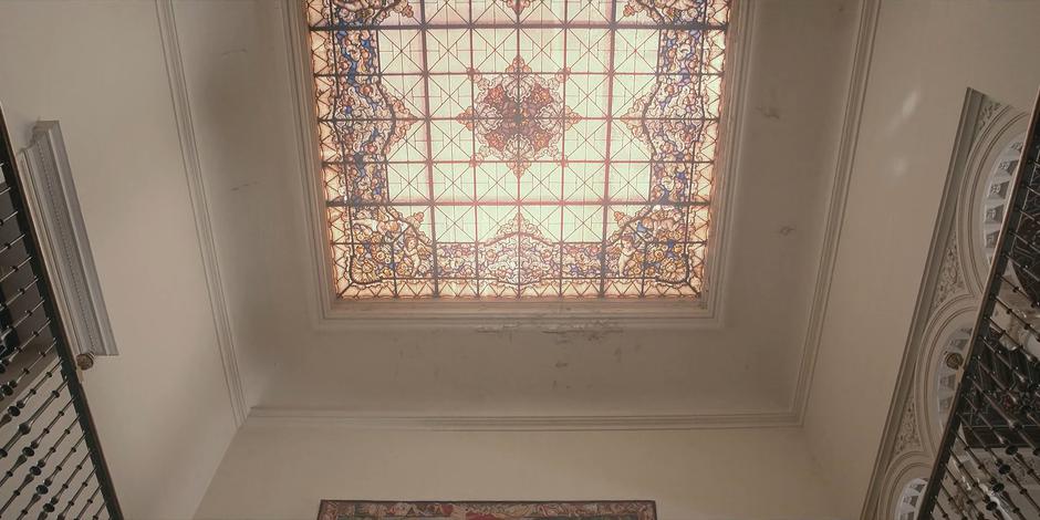 View of the sun shining through the ornate skylight.