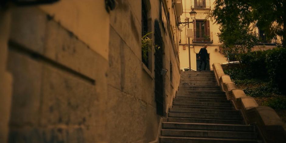 Vincent stumbles down the steps near the bar.