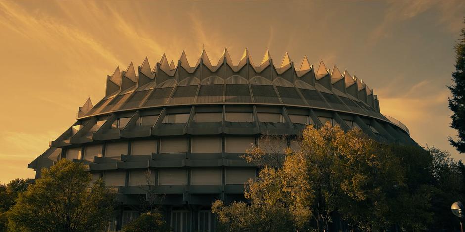 Establishing shot of the church bathed in the orange sunlight.