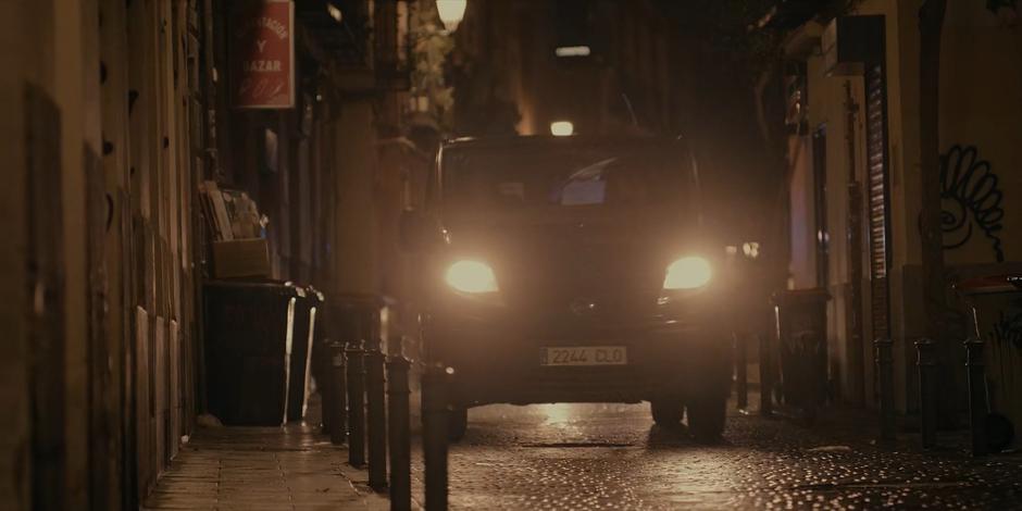 The van races down the deserted street at night.