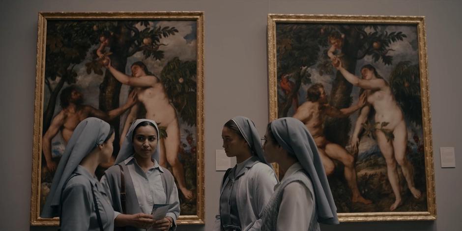 Ava, Yasmine, Bea, and Camila stop in front of a pair of paintings before splitting up.