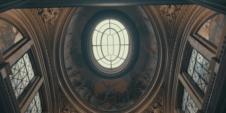 A oval skylight shines down into the chamber.