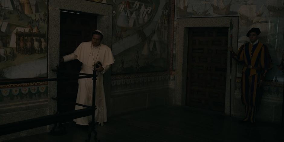 Pope Duretti exits the basement stairs after his torture session.