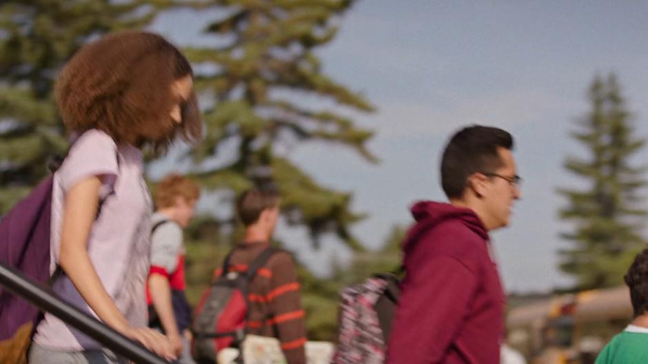 Sarah walks down the front steps as school lets out.