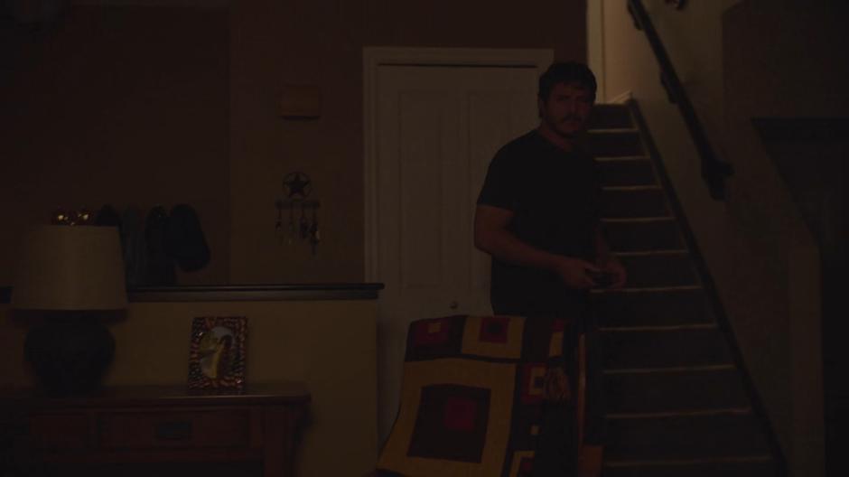 Joel enters the house at night and finds Sarah waiting for him.