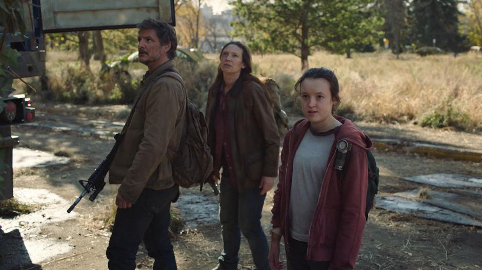 Joel and Tess examine the truck as Ellie notices the blood trail leading inside the building.