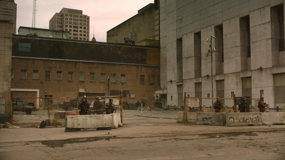 Guards stand watch outside the former FEDRA compound.