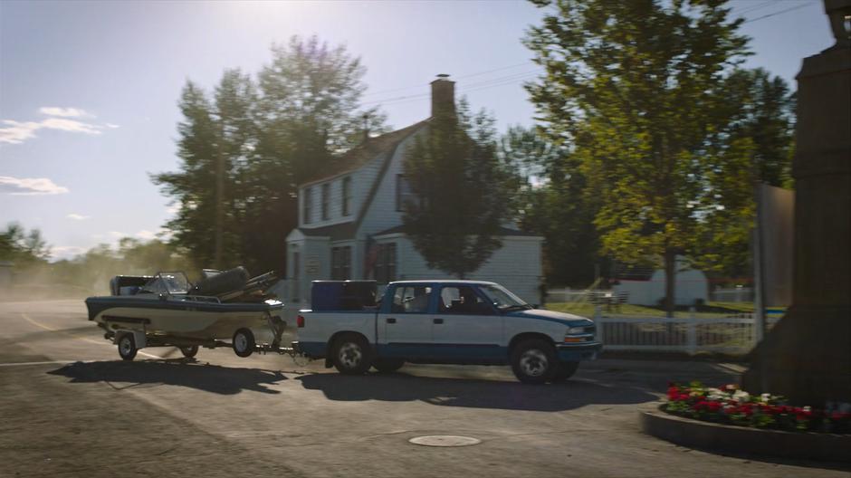 Bill drives back to the neighborhood with a boat load of stuff behind his truck.