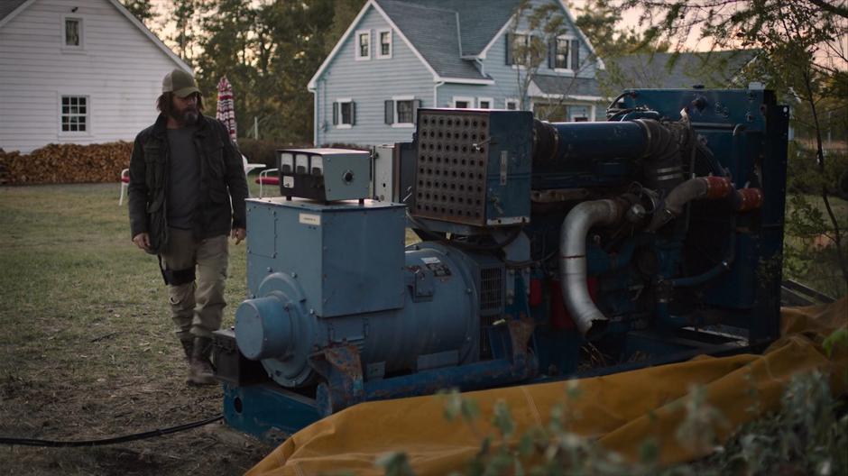 Bill examines his generator after getting it running.