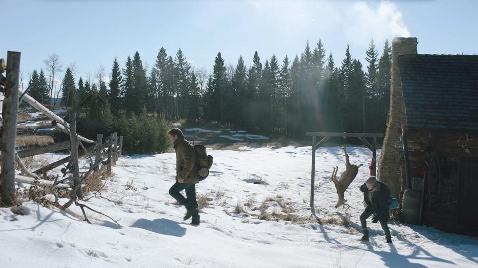 Ellie follows Joel as he walks towards the gate.