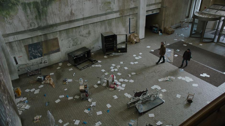 Joel and Ellie enter the lobby of the lab building to find papers and equipment lying in disarray.