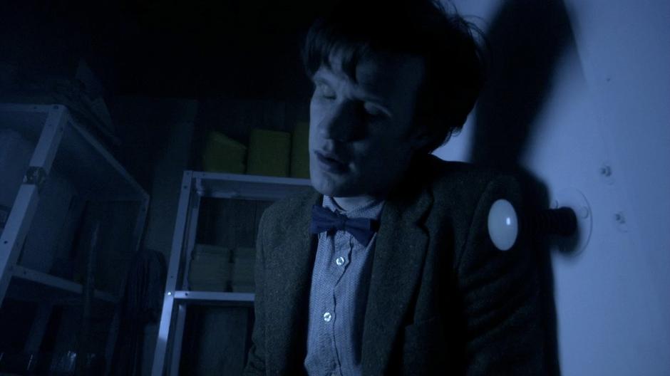 The Doctor passes out inside the freezer.