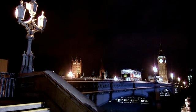 Rose and the Doctor run across the bridge towards the London Eye.