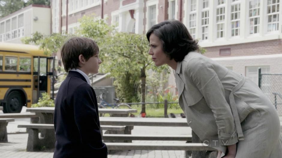 The Mayor talks to Henry out front of his school.