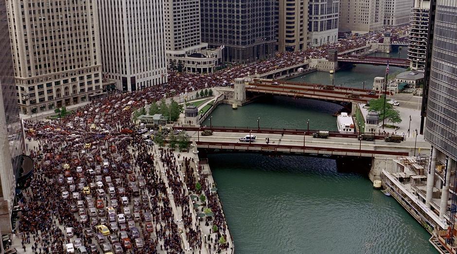 Crowds mass around the bridge that the police are searching.