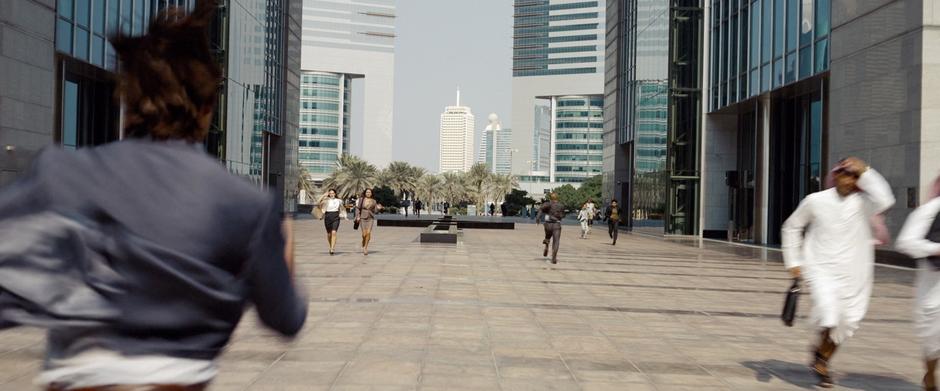 Ethan Hunt chases after Kurt Hendricks outside the hotel.