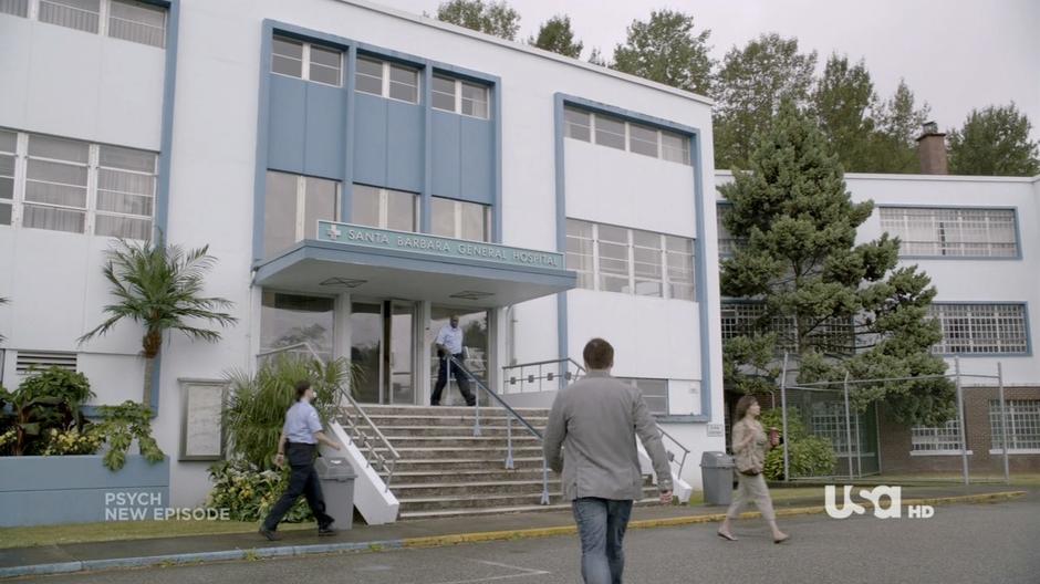 Establishing shot of the hospital front entrance.