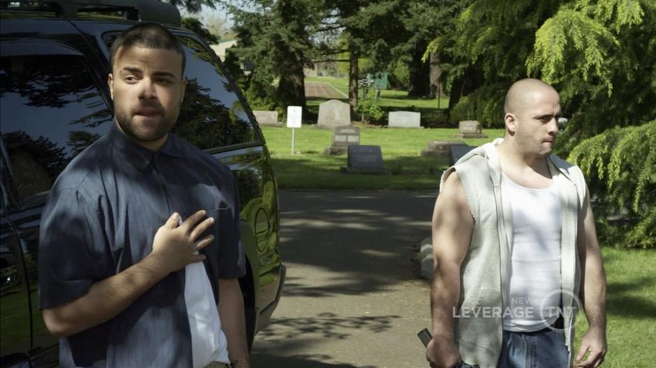 Thugs guard the grave where Hardison is buried.