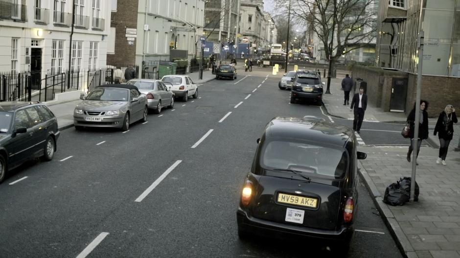 Sherlock and Watson drive away from the flat in a taxi.