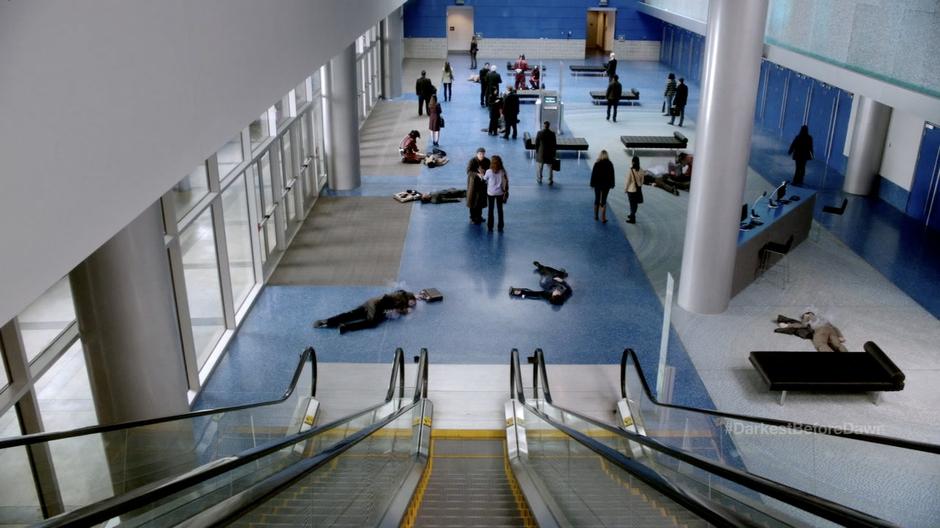 Walter talks to Jessica Holt at the bottom of the escalator.