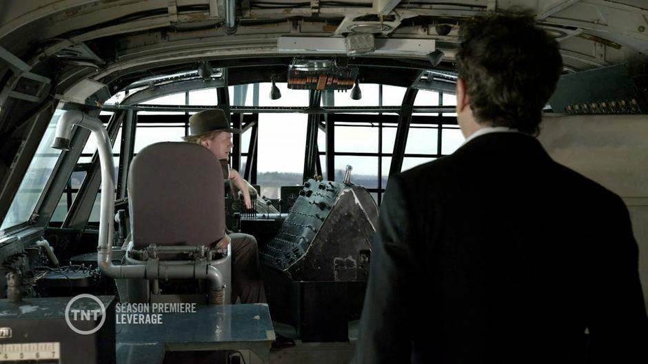 Nate and Scott Roemer talk in the cockpit of the Spruce Goose.