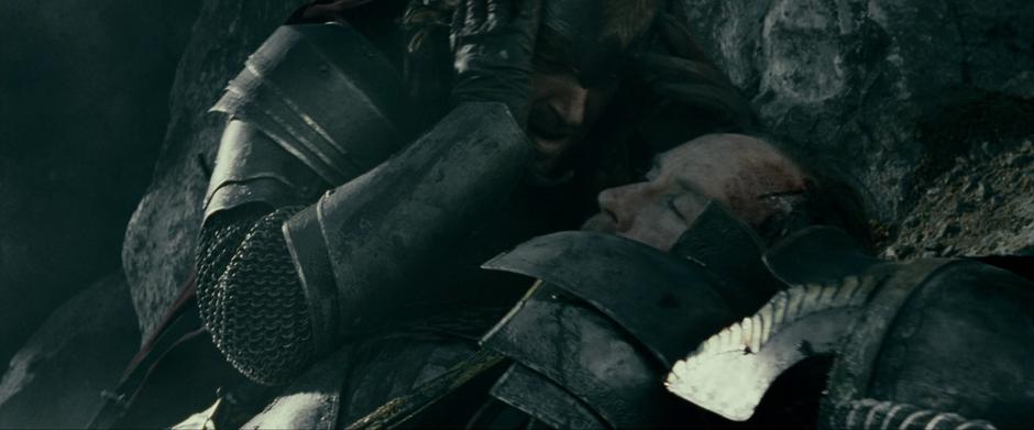 Isildur crouches next to his recently struck down father, Elendil.