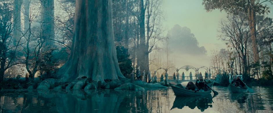 The Fellowship boats down the river away from Lothlórien.