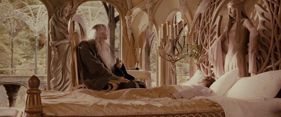 Gandalf sits over Frodo's sick bed.