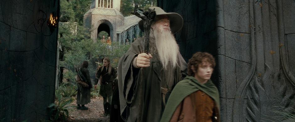 Frodo and Gandalf lead the Fellowship out of Rivendell.