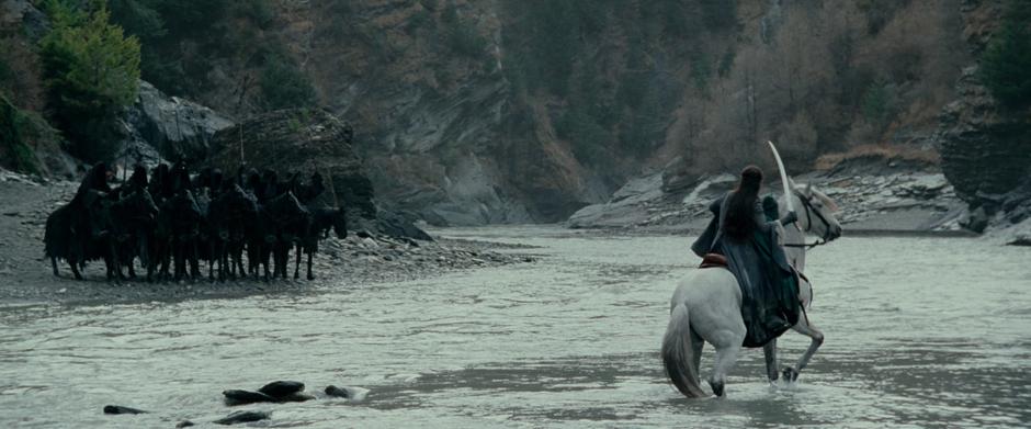 Arwen faces down the Black Riders and prepares to call down the waters of the ford.