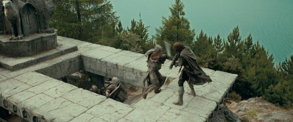 Aragorn fights some orcs atop the Seat of Seeing.