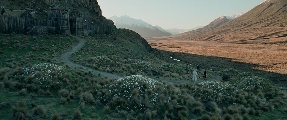 Gandalf and Theoden talk next to Théodred's grave after the funeral.