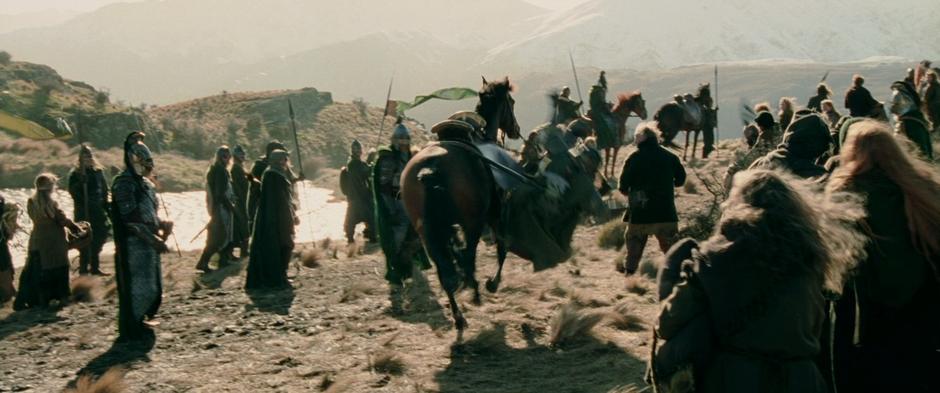 Gimli's horse runs off dropping him to the ground.